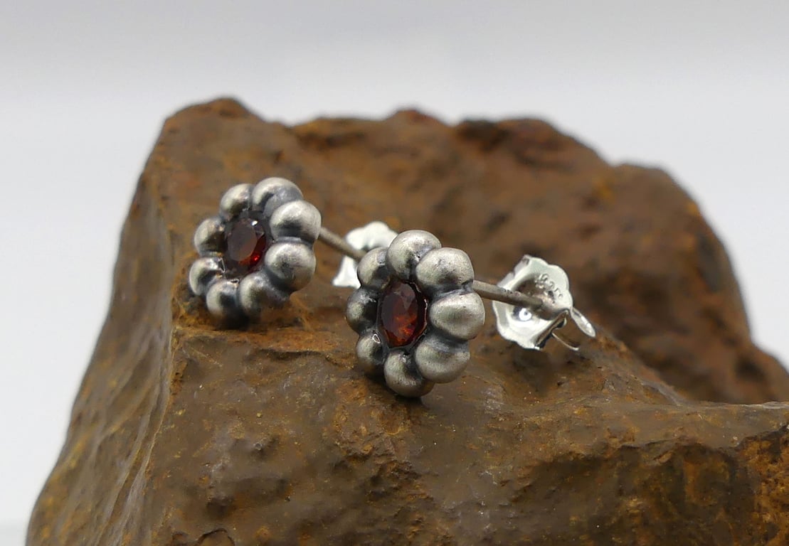 Recycled Sterling Silver Flower Stud Earrings with Garnet Gemstones.