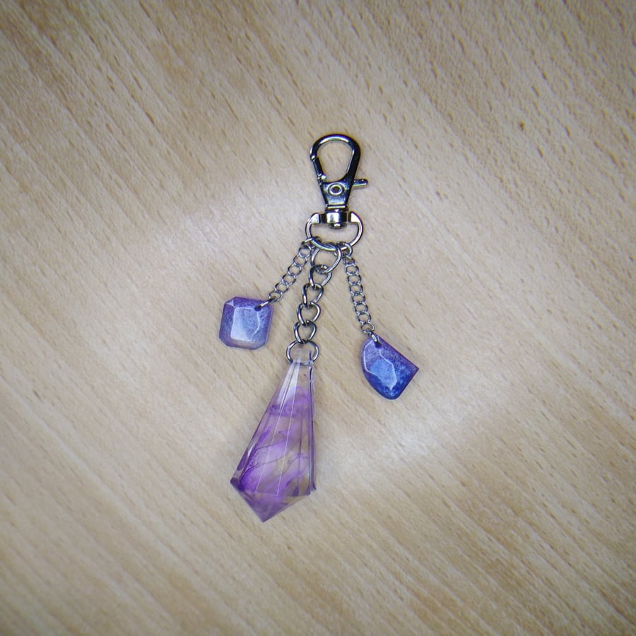 Purple swirl resin crystal bag charm