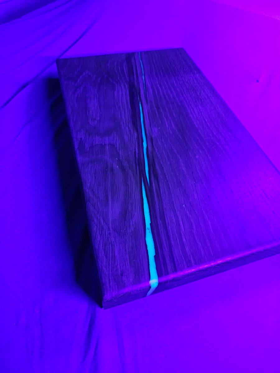 Oak chopping with blue glow in the dark epoxy resin 