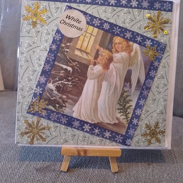 two angels looking in  at the church window