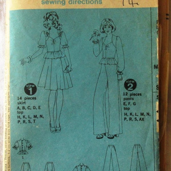 A vintage sewing pattern for a misses' skirt, trousers and peplum top in size 14