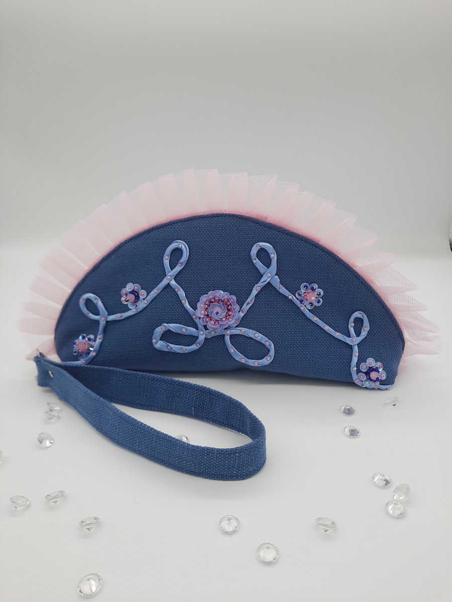 Blue and pink beaded clutch bag with wrist strap.  