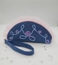 Blue and pink beaded clutch bag with wrist strap.  