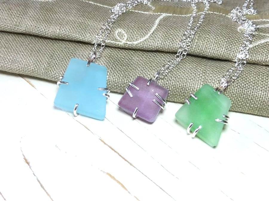 Seaglass pendants in a Pale Blue a Pale Dusky Plummy and a Pale Green Colour