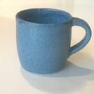 Stoneware pottery mug finished in a denim blue satin glaze