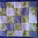 Patchwork cushion cover in lime green and grey polyester. 14x14 ins 37x37 cm