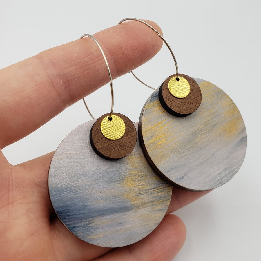 Silver, gold and white earrings with walnut and gold coloured discs