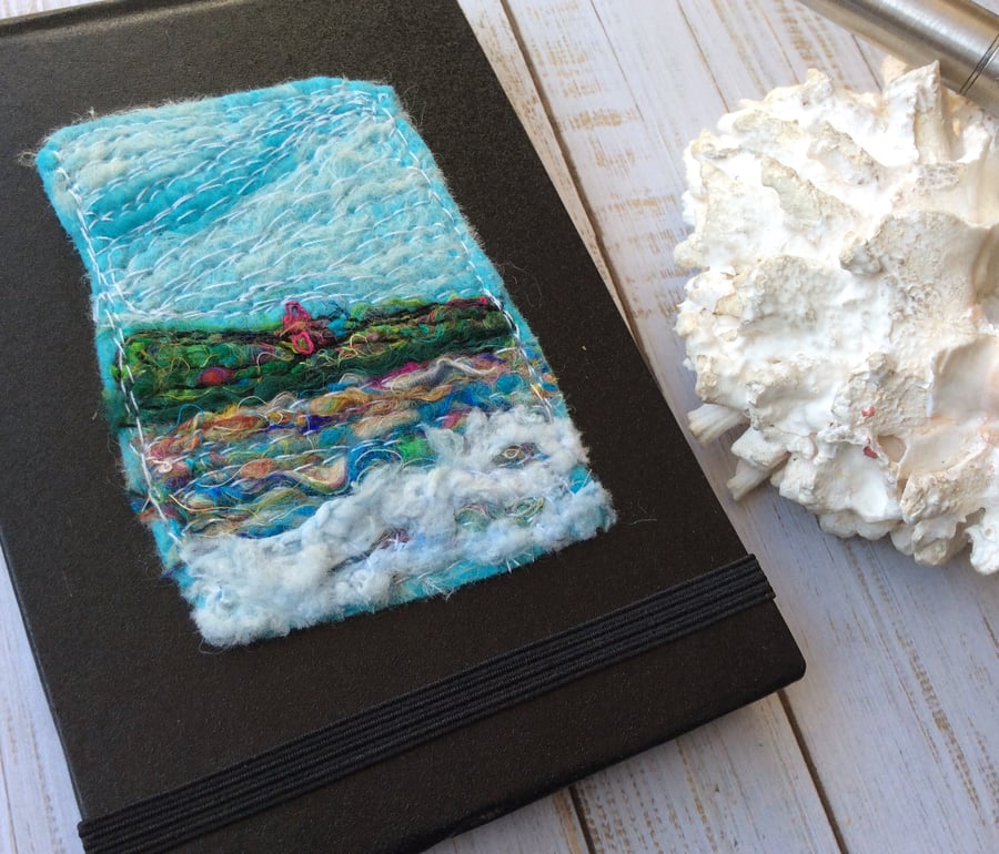 Embroidered seascape pocket notebook.
