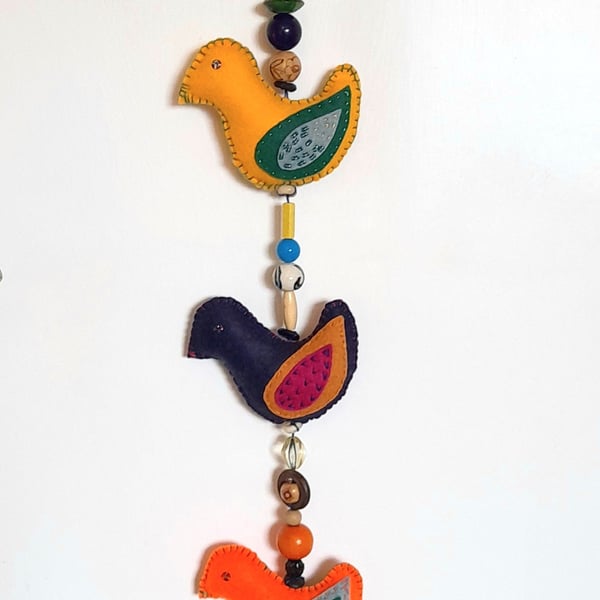 Sweet Tweets - A skein of decorated felt birds, joined with beads, ready to hang