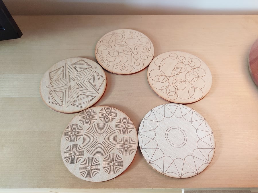 Set of 5 shapes designed round coasters