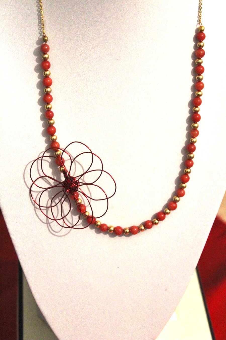 Beaded necklace with wire flower accent 