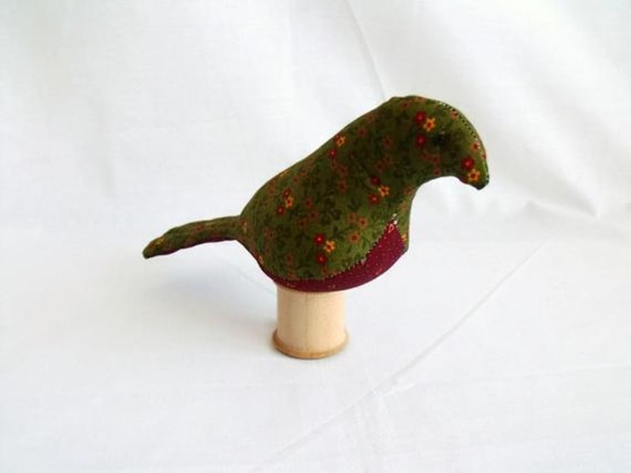 novelty bird ornament or bird pin cushion on a vintage wooden bobbin, green