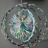 Colourful Fairy Wind Spinner with little green heart suncatcher art deco style.