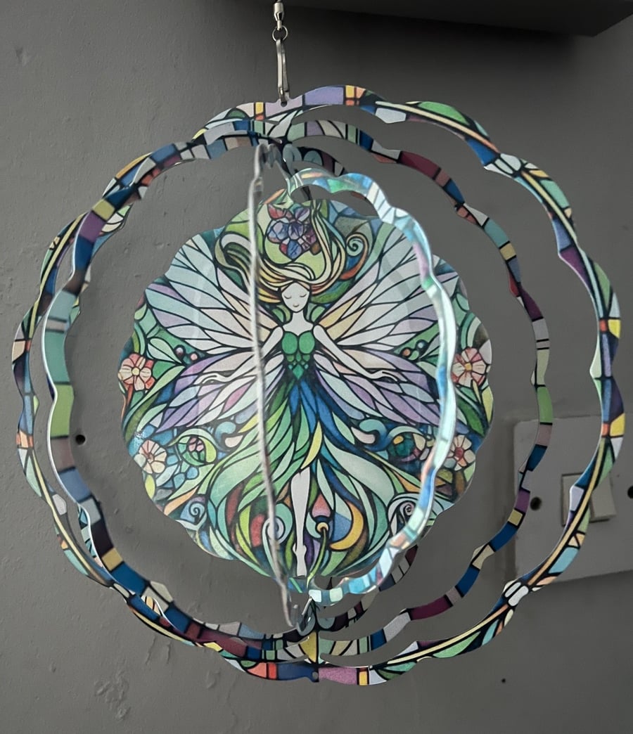 Colourful Fairy Wind Spinner with little green heart suncatcher art deco style.