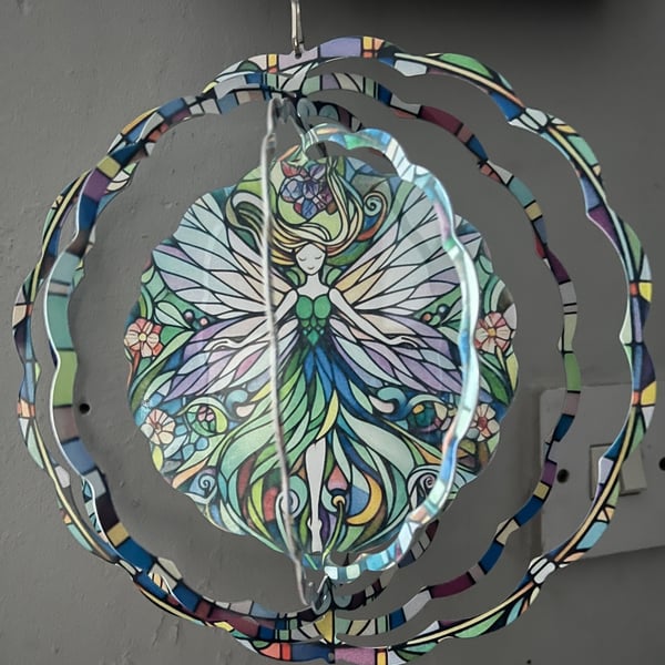 Colourful Fairy Wind Spinner with little green heart suncatcher art deco style.