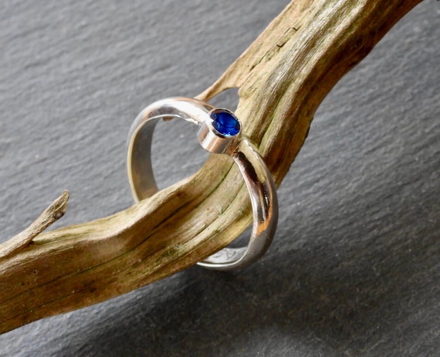 Deep Blue Stone in Bright Silver Ring.
