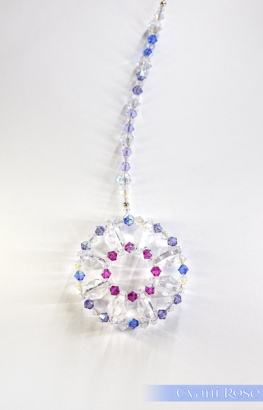 Beautiful sparkly Swarovski Sun Catcher hanging decoration in pink blue