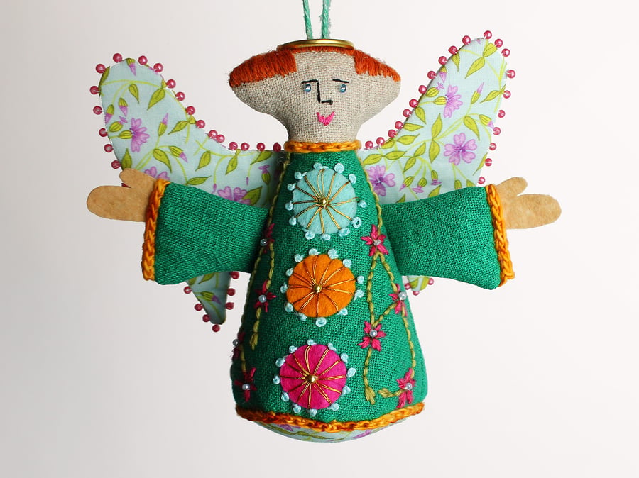 Emerald green linen hanging angel with folk embroidered dress