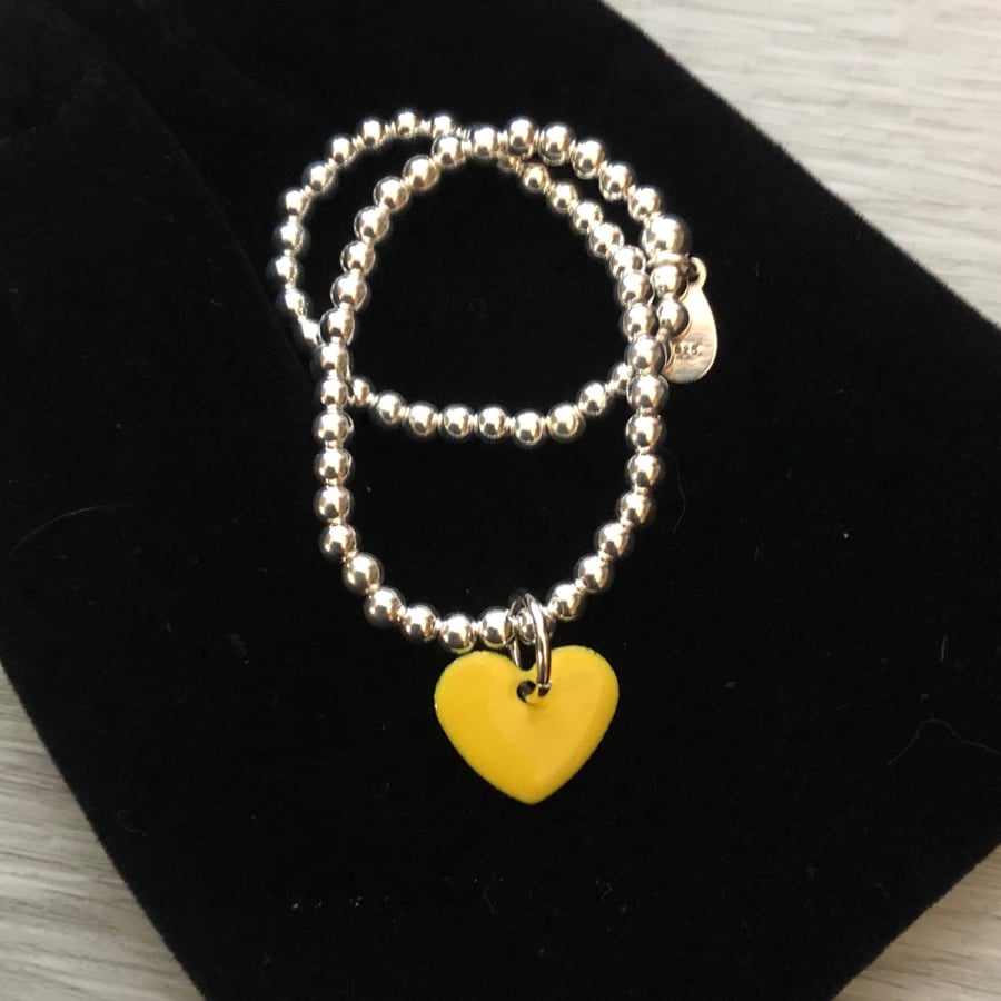  Yellow enamel heart on silver beaded stretch bracelet. Stacking bracelet.