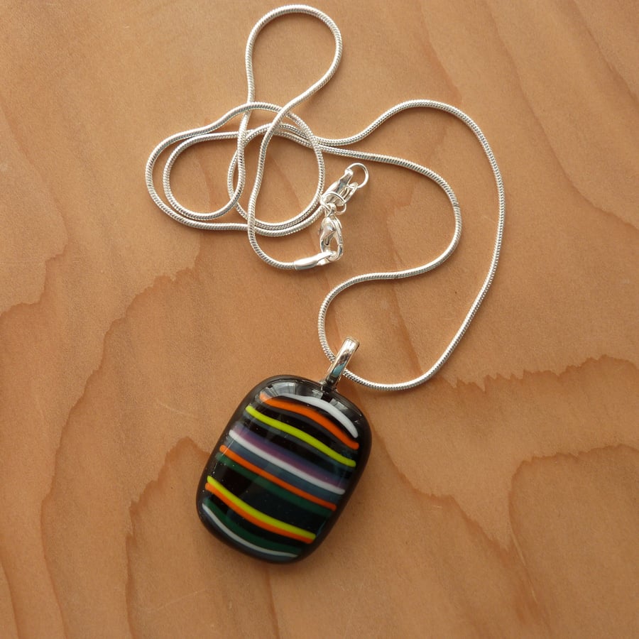 Bright stripes on black glass necklace