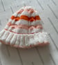 Hand knitted striped baby hat with cable pattern  - Image 1