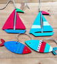Hand painted hanging wooden fish and sailboat decorations for nautical décor 