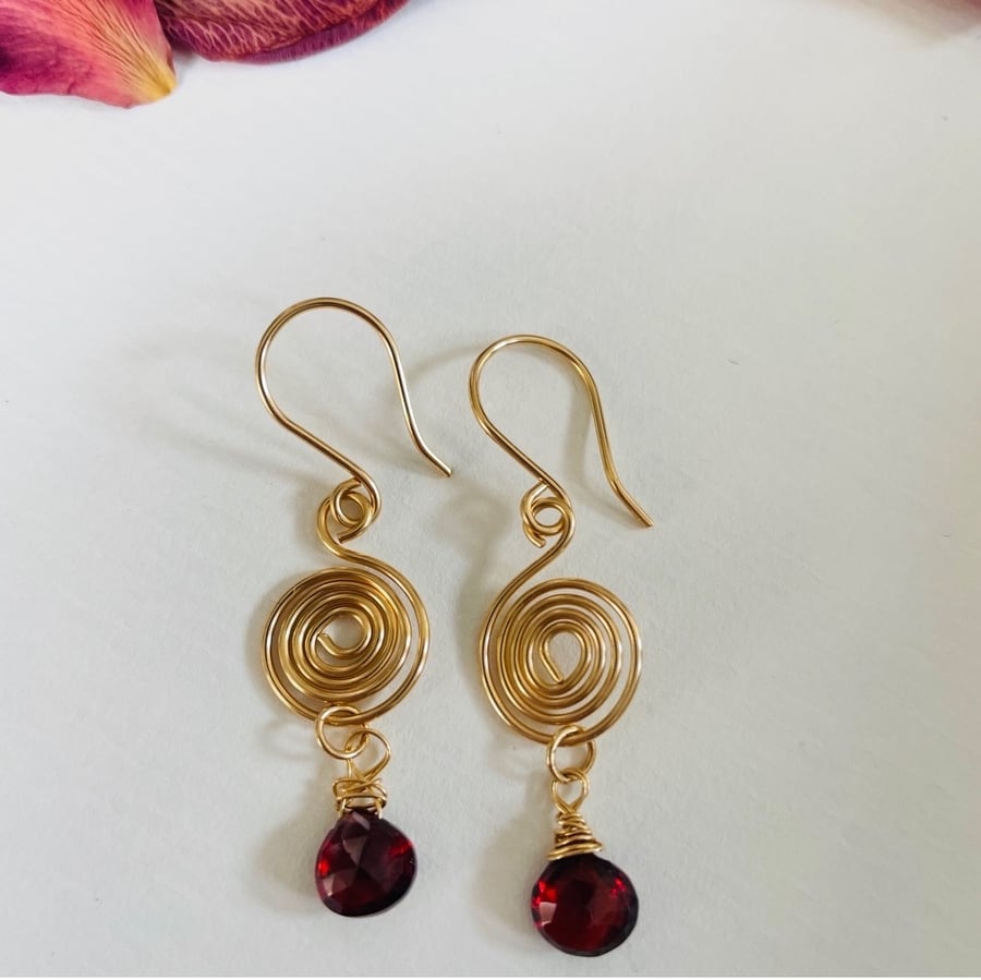 Gold and Garnet contemporary swirl earrings 