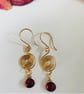 Gold and Garnet contemporary swirl earrings  - Image 1