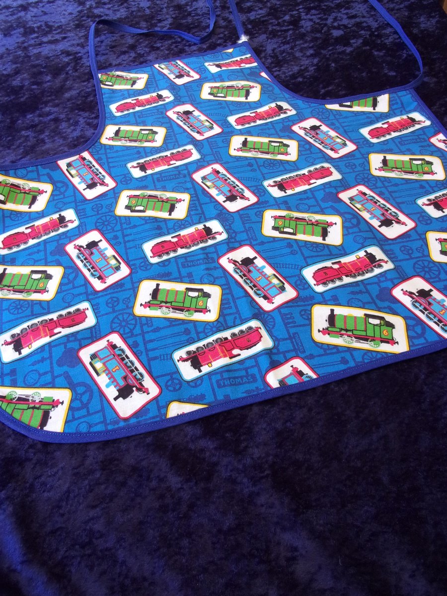 Baby Apron with Thomas the Tank Engine and Friends on a Blue Background