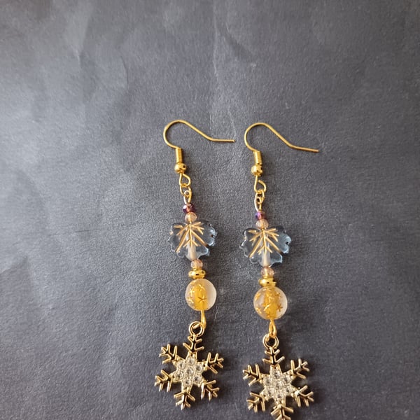 Gold beaded snowflake charm dangle earrings 