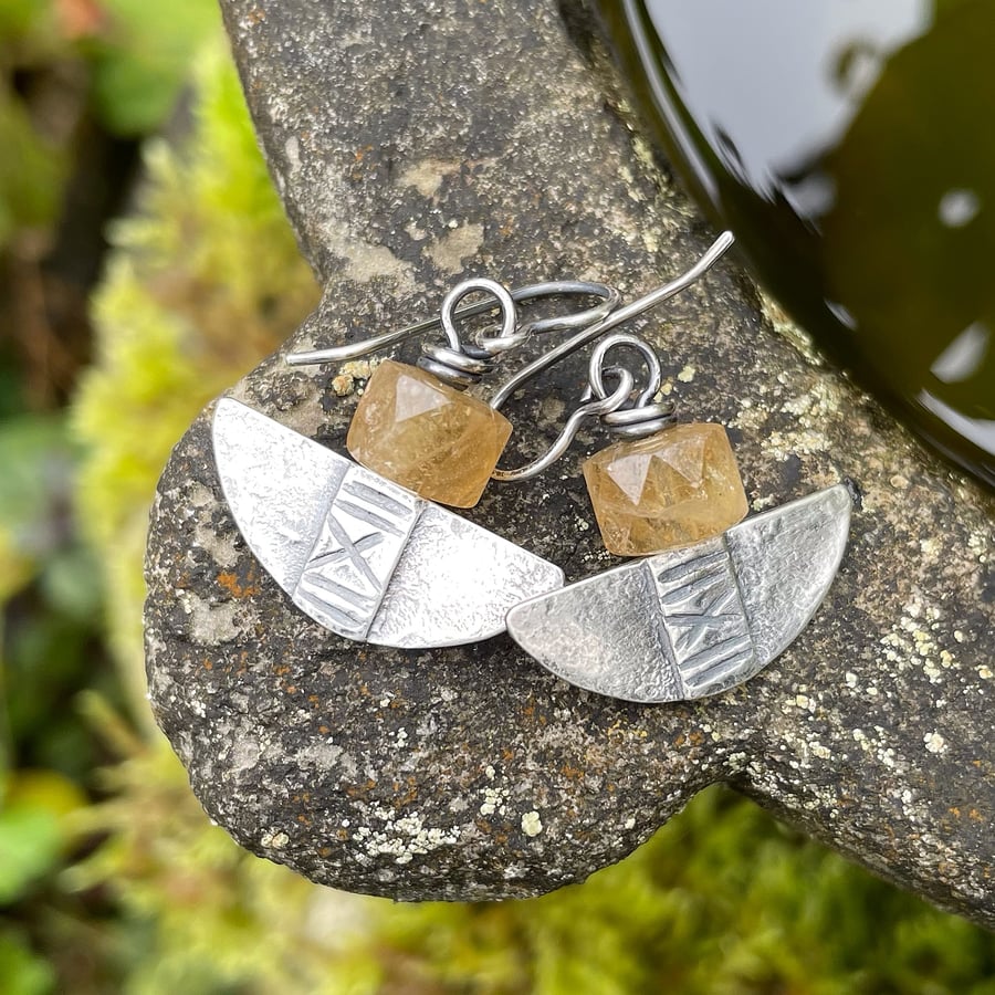 Silver and citrine tribal blade earrings.
