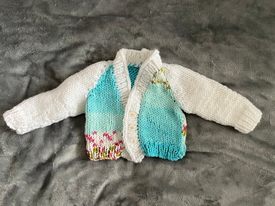 Hand knitted baby cardigan in blues and white