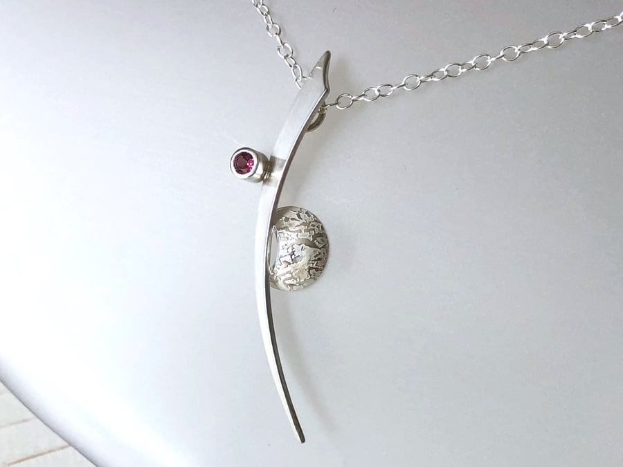 Curved Silver Pendant with Pink Topaz