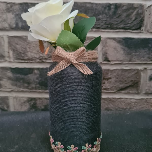 Dark grey yarn wrapped vase with ribbon and jute trim