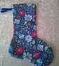Poinsettia, Baubles and Pine Cones on Blue 10.5 inch Stocking