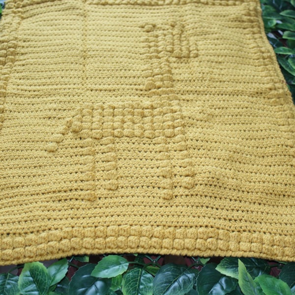 handmade crochet bobble baby blanket with giraffe design