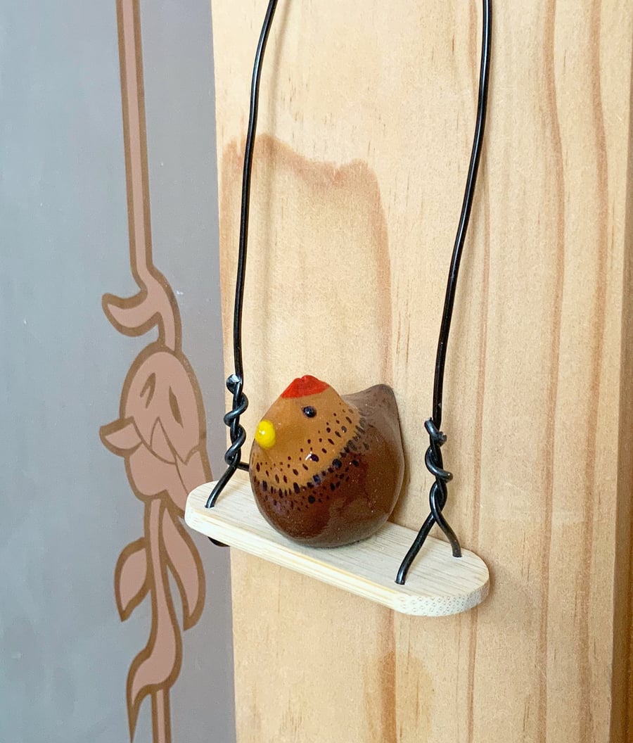 Miniature Chicken. Chicken On A Swing. Chickens. Hanging Decorations.