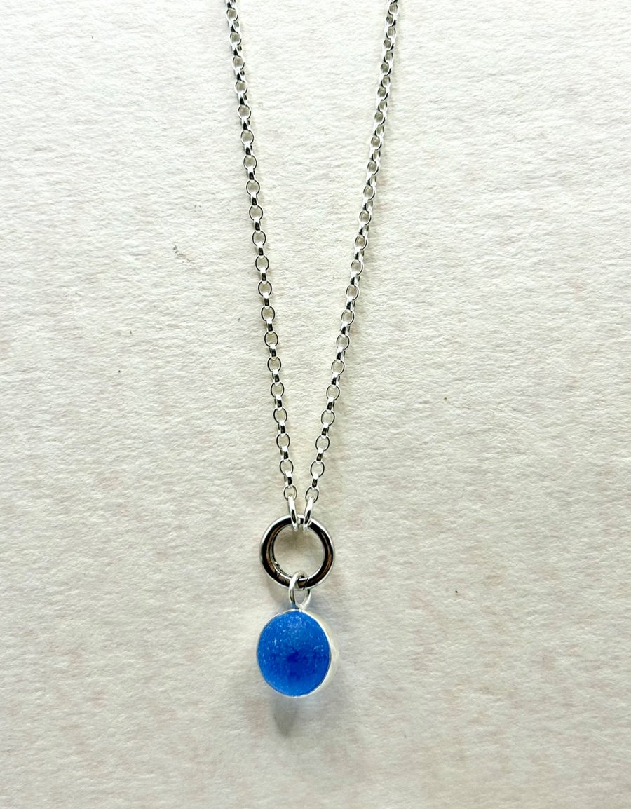 Cornflower blue spinning marble pendant on 20 inch chain