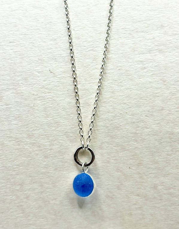 Cornflower blue spinning marble pendant on 20 inch chain