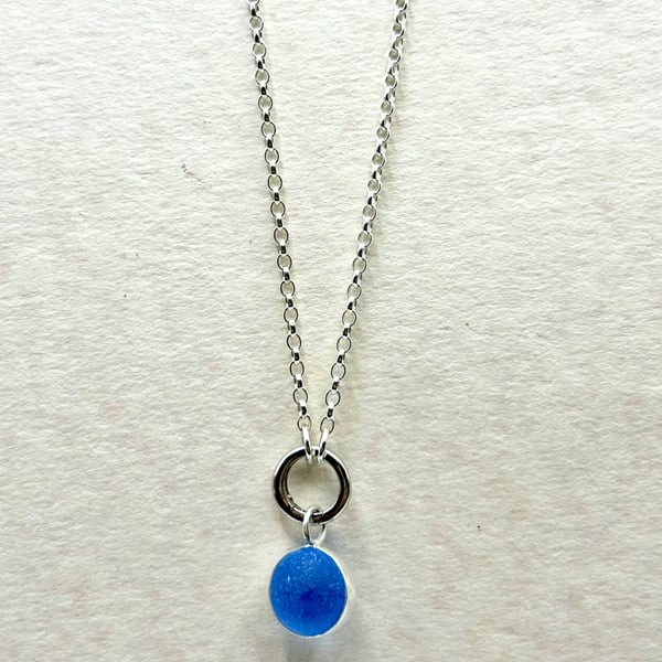 Cornflower blue spinning marble pendant on 20 inch chain