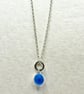 Cornflower blue spinning marble pendant on 20 inch chain