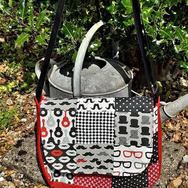 Messenger bag in red, white and black patchwork