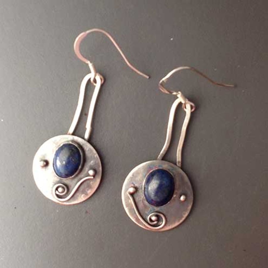 Silver and blue dangle shield earrings