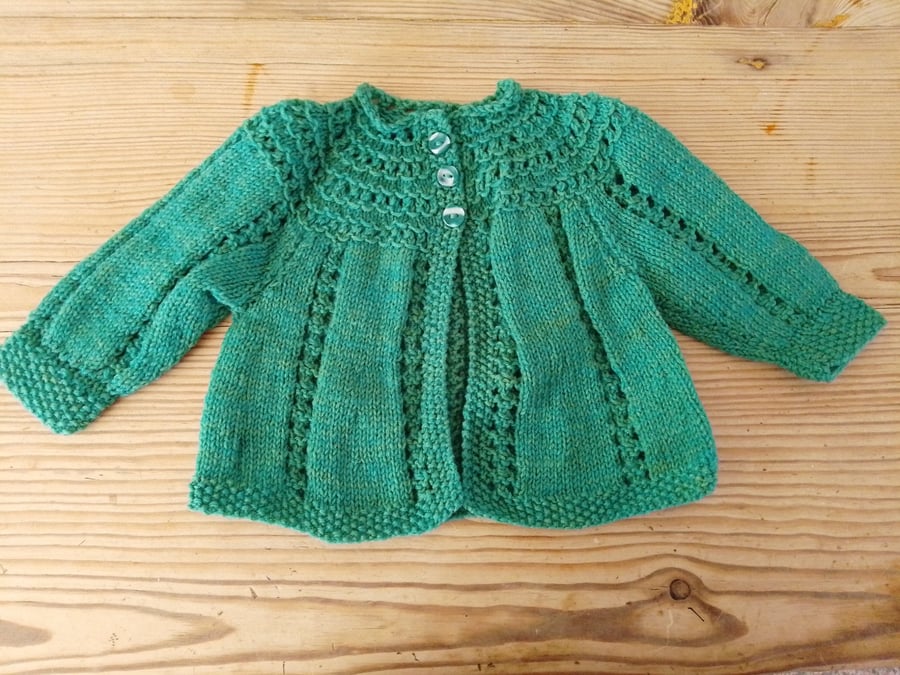 Baby cardigan in a green fleck yarn for age 3-6 months