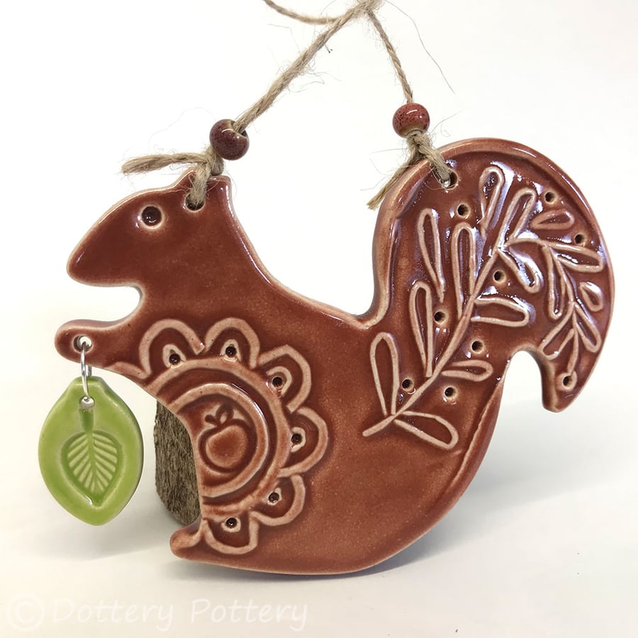 Ceramic squirrel with leaf decoration