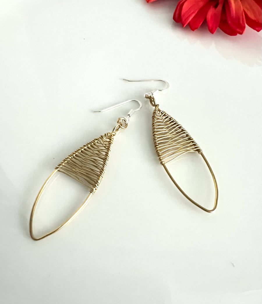 Polished Brass Oval Earrings with delicate wire weaving.