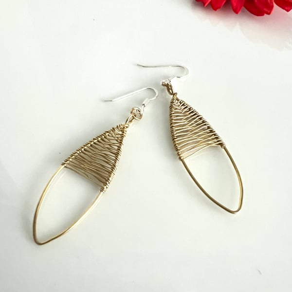 Polished Brass Oval Earrings with delicate wire weaving.