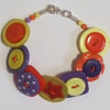SALE: Orange, yellow and purple button bracelet