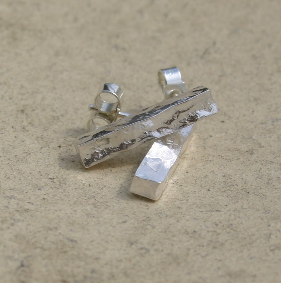 Square silver stud earrings with a hammered finish