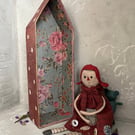 Paper mache rag doll with teddy bear